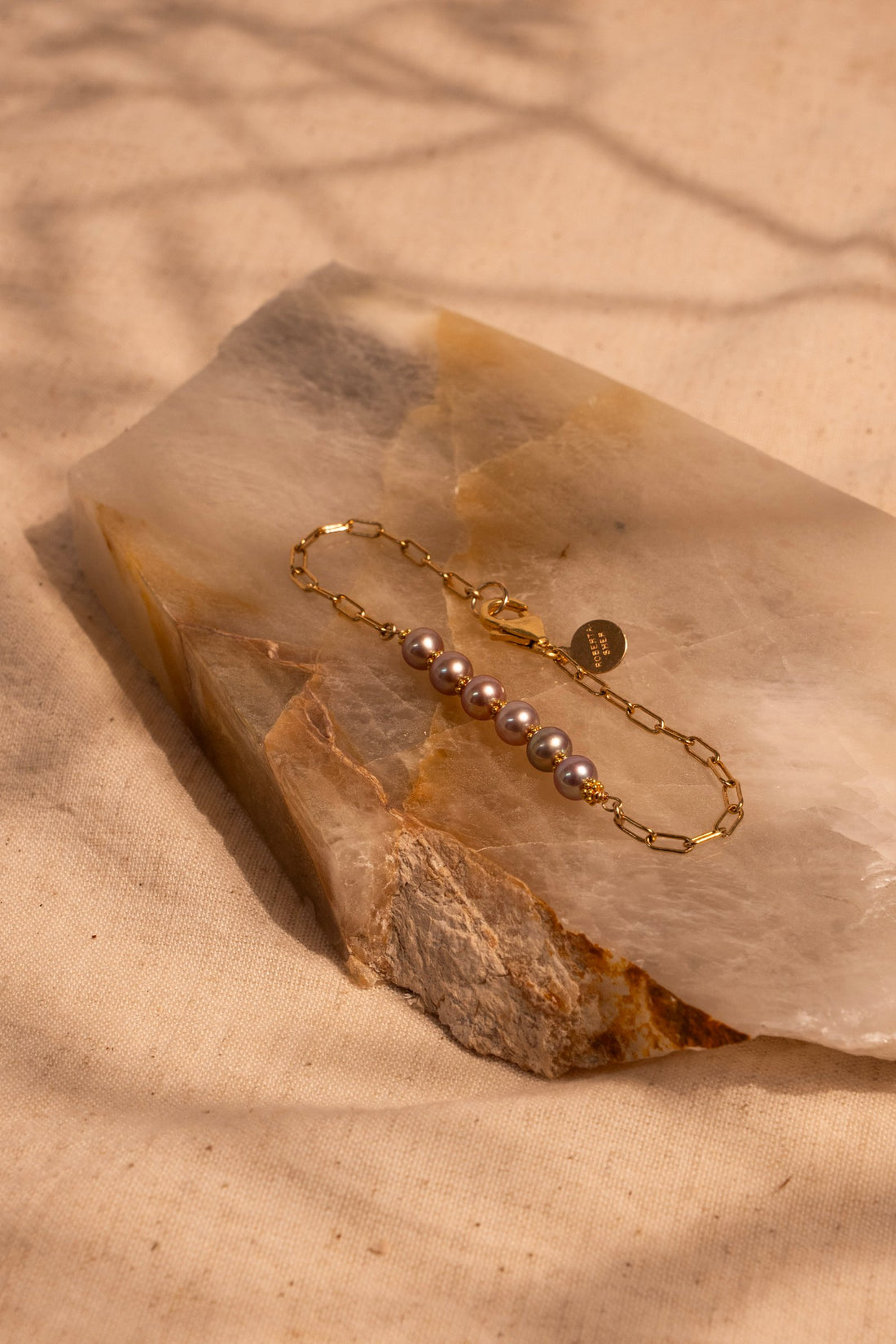 6- 5mm Champagne Pearls and 18Kt gold Accents on a paperclip chain creates a perfect piece