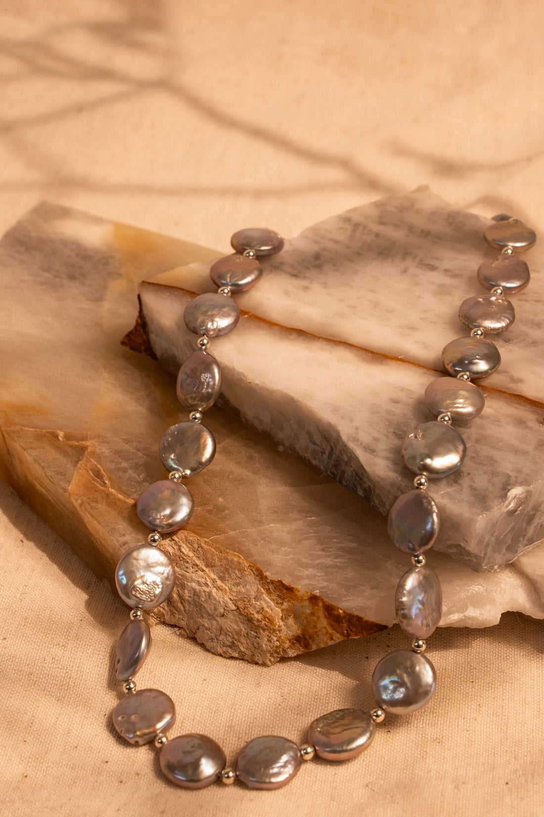A Gray/Silver Strand of  Coin Pearls with Sterling Silver Bead Accents