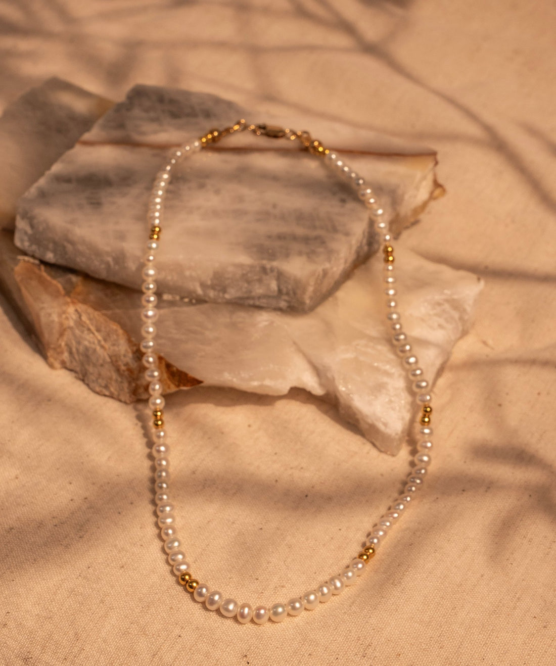 A 15.5" Hand Tied White Pearl and Gold Filled Bead Necklace