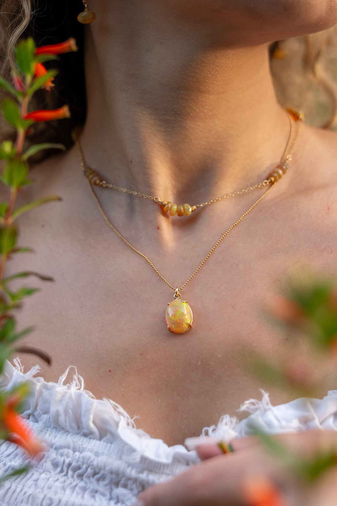 Cab set Fire Opal in a 14kt Gold Setting on a 16" Gold Bead Chain