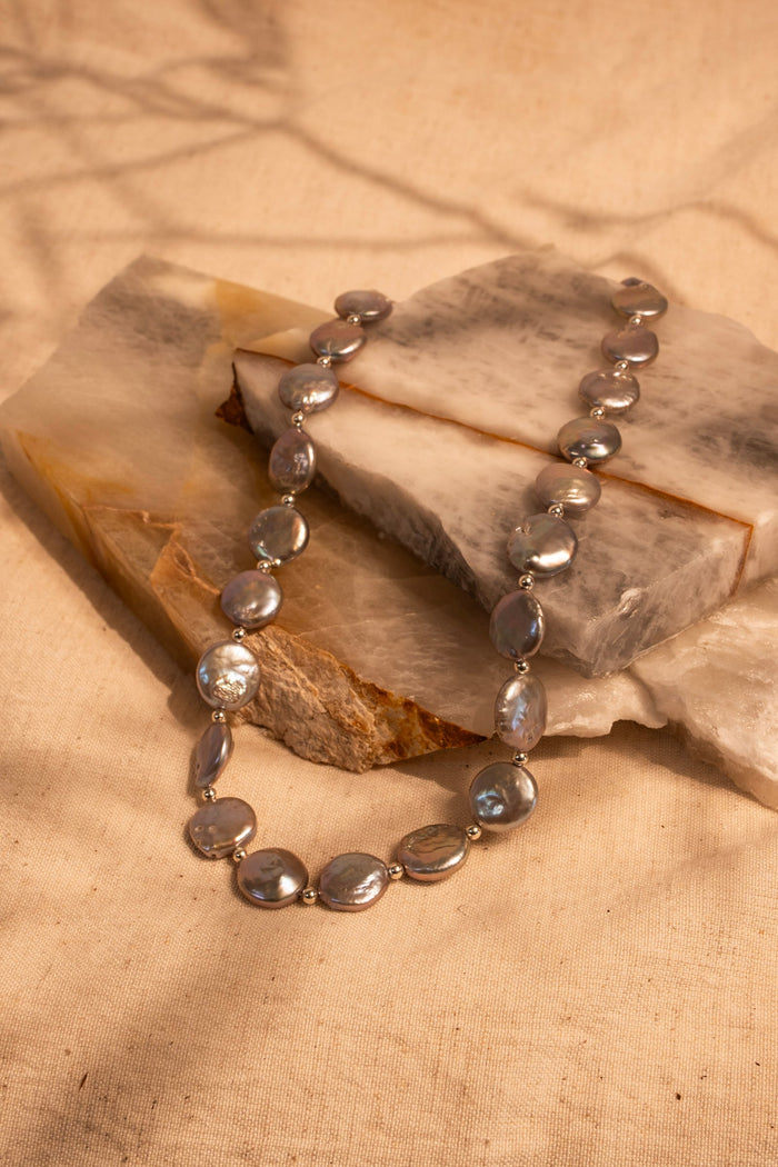 A Gray/Silver Strand of Coin Pearls with Sterling Silver Bead Accents