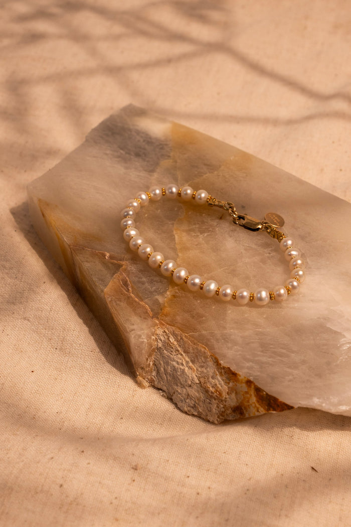White Pearl and 18Kt gold Spacers hand made Bracelet. Shown in 7"