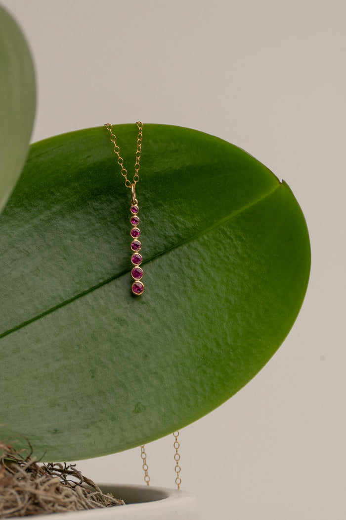 7 Bezel Set Rubies in 14Kt Gold Column. A beautiful Necklace in gorgeous Ruby on a 15" Delicate Chain