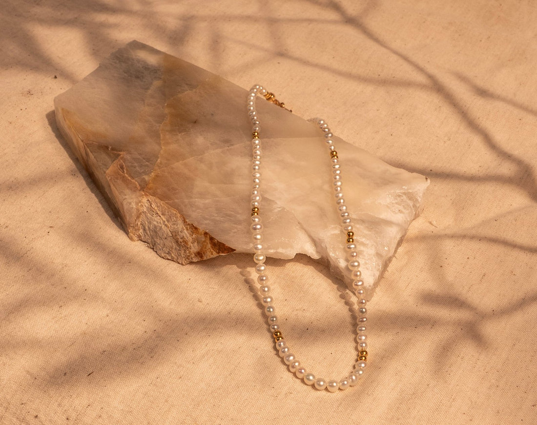 A 15.5" Hand Tied White Pearl and Gold Filled Bead Necklace